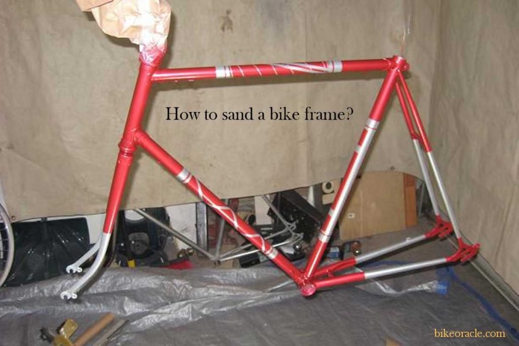sanding a bike frame for painting